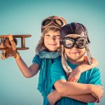 children playing with toy airplane