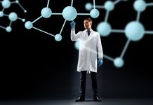 Scientist in lab coat with molecules