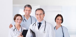 Male Doctor In Front Of Team