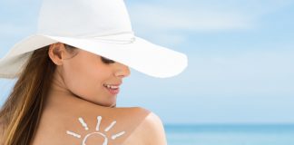 Sun Drawn On Woman's Shoulder With Sun Protection